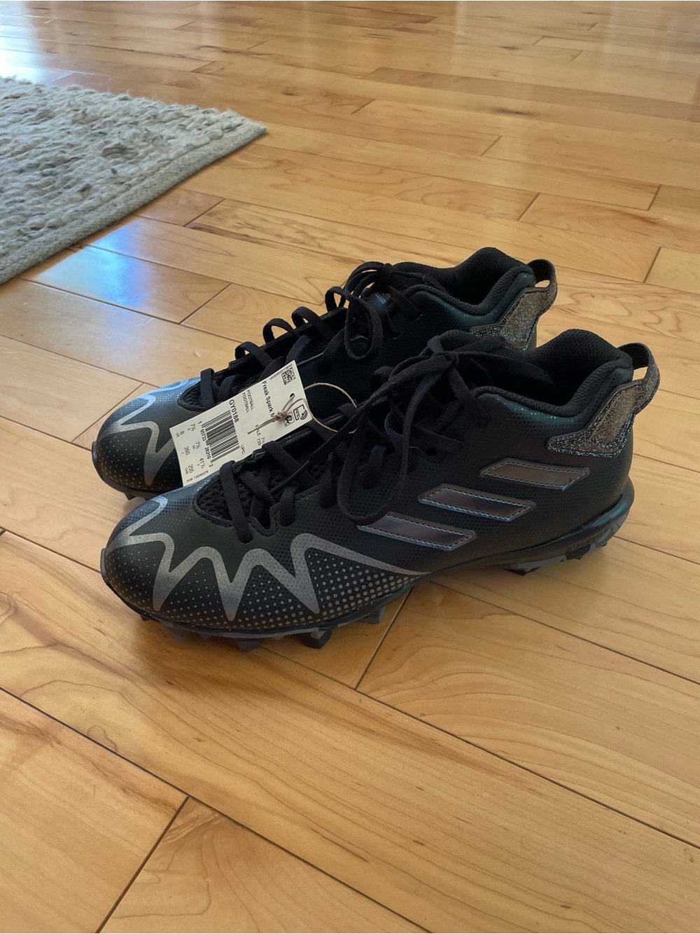 NEW - adidas Black Athletic Cleats with Reflective Silver Accents